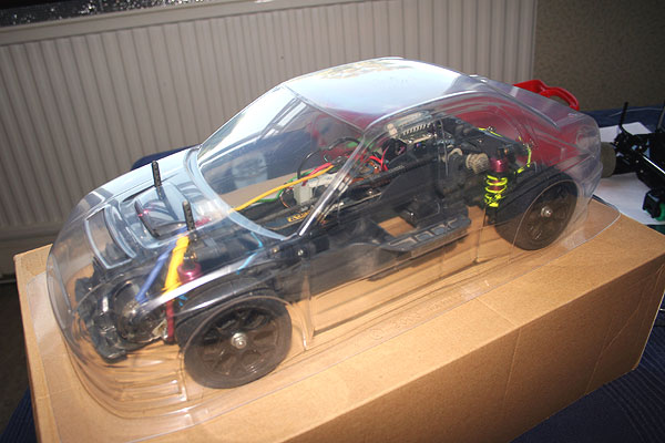 New shell arrives, trial fit over my �20 ebay TA03 chassis
